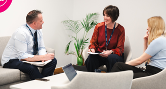 Three people having a meeting